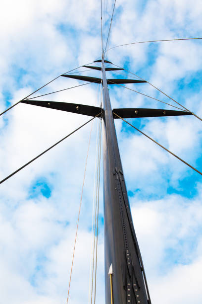 masts of sailing yachts without sails with anchoring ropes. view from below. - repairing sky luxury boat deck imagens e fotografias de stock