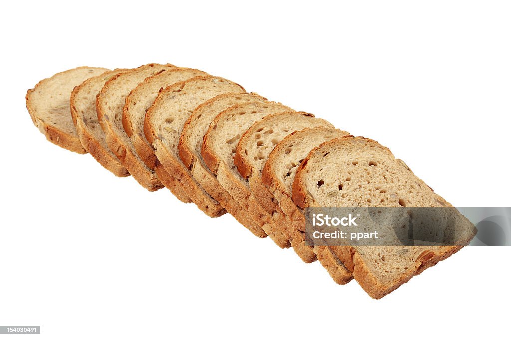 Bread with pumpkin seeds Sliced loaf of bread with pumpkin seeds isolated over white background with clipping path. Abundance Stock Photo