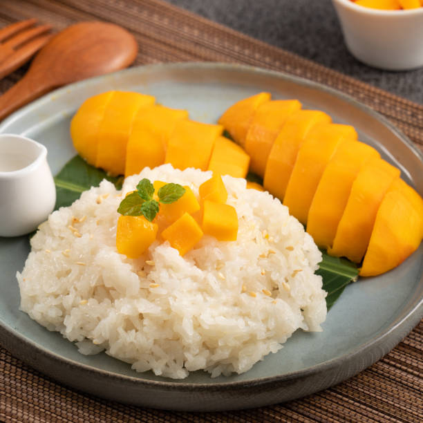 istock Delicious Thai mango sticky rice with cut fresh mango fruit in a plate. 1540312737