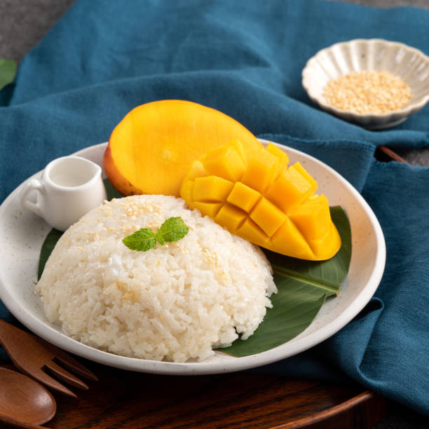 istock Delicious Thai mango sticky rice with cut fresh mango fruit in a plate. 1540312798