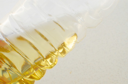 Cooking oil bottle in focus, providing practicality and flavor to your preparations.