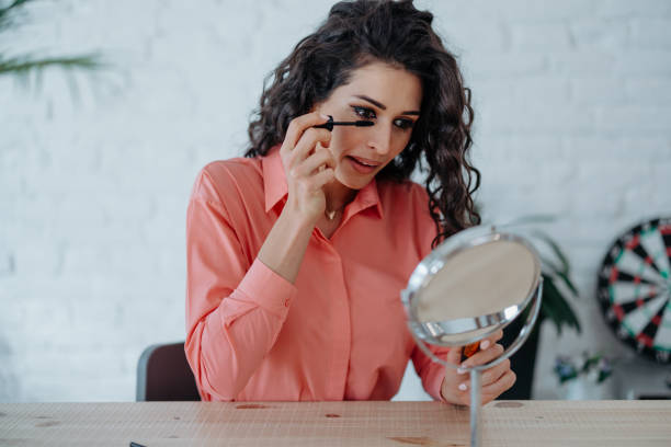 istock Woman putting on mascara 1540329556