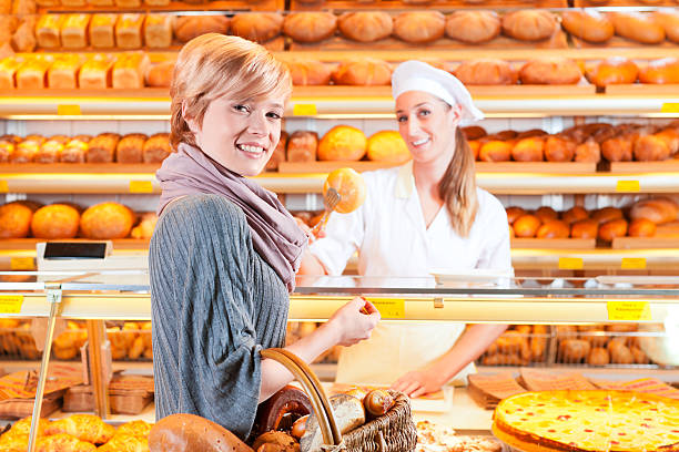 istock Salesperson with female customer in bakery 154033247