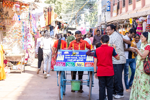 Pushkar, Rajasthan, India - November 05 2022: Street vendor selling their products on the street during pushkar fair.
