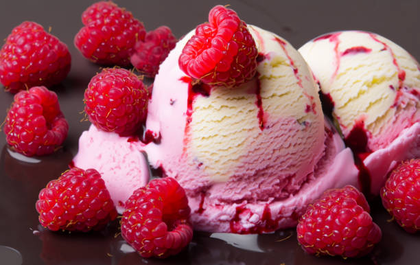 istock Vanilla and chocolate ice cream with raspberries 1540347623