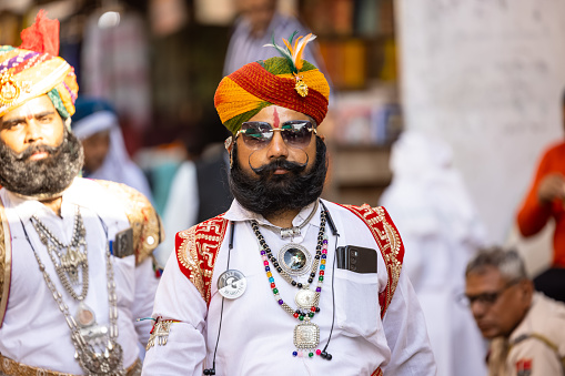 Pushkar, Rajasthan, India - November 2022: Pushkar Fair, Portrait of an unidentified rajasthani rajput male in ethnic dress with jewelry and mustache on fair ground during pushkar fair.