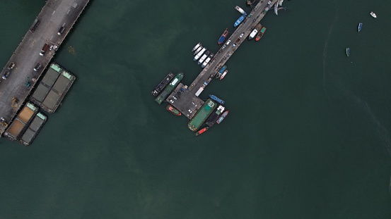 Aerial top view of fisherman dock which has  ships anchoring for transport supplies inland ,fisherman harbor and local logistics port Pier