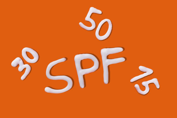 istock SPF cream. Sunscreen cream on orange background. 1540367176