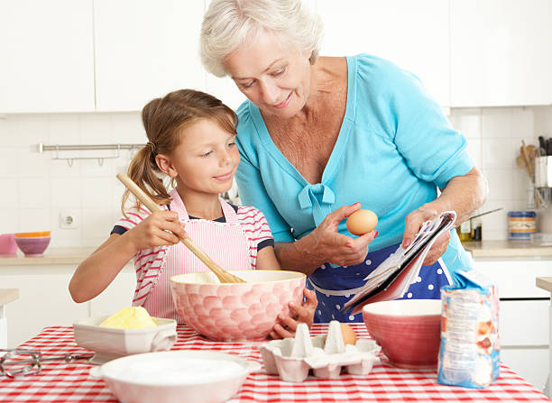 istock Grandmother And Granddaughter Baking In Kitchen 154038335