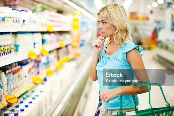 Woman Shopping Dairy In A Food Store Stock Photo - Download Image Now - Milk, Supermarket, Shopping