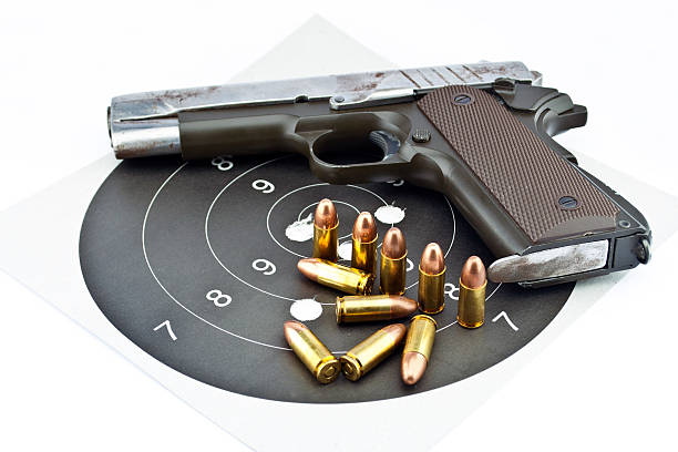 istock 9-mm handgun and bullets 154038934