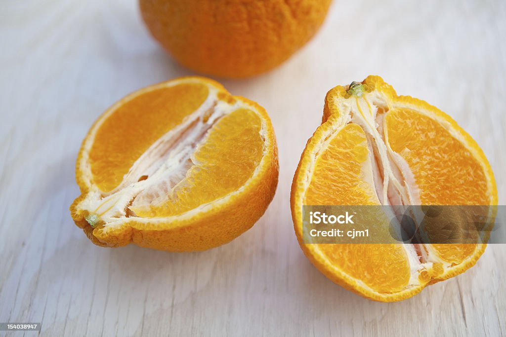 Fresh Orange Halves fresh orange cut in half. Citrus Fruit Stock Photo