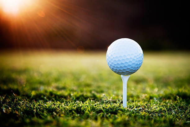 Golf Close up of golf ball on tee sports ball photos stock pictures, royalty-free photos & images