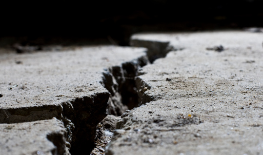 cracked road concrete close up earthquake damage