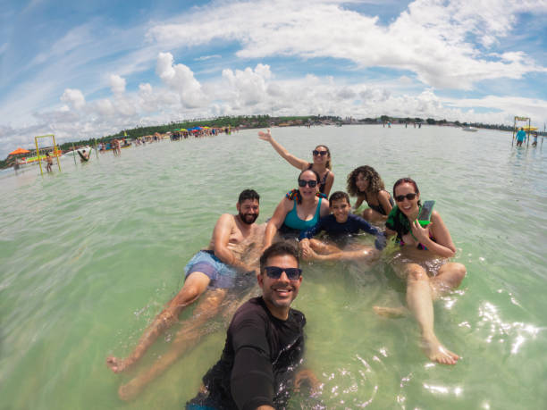 Family taking a selfie on the tropical beach