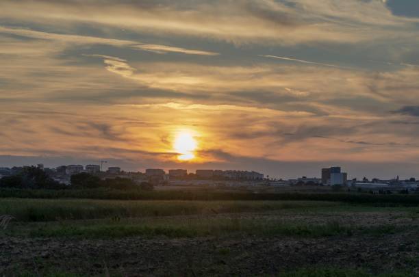 istock Urban panorama with sun at sunset 1540426106