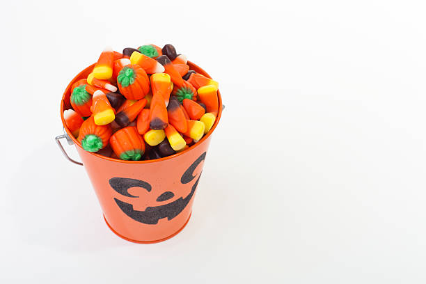 istock Bucket of Halloween Candy on White, Copy Space 154043801