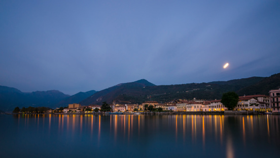 Lake Iseo lights reflections on water during sunset