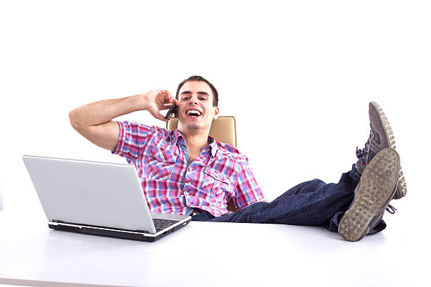 istock Confident business man talking with telephone. 154047357