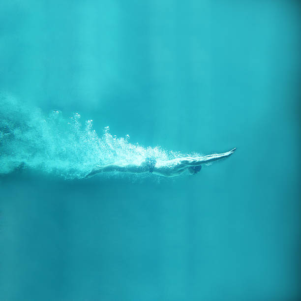 istock professional swimmer underwater after the jump 154047502
