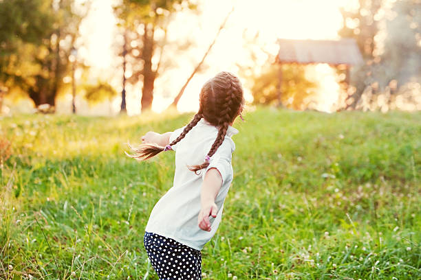 istock girl enjoying the sunset 154047634