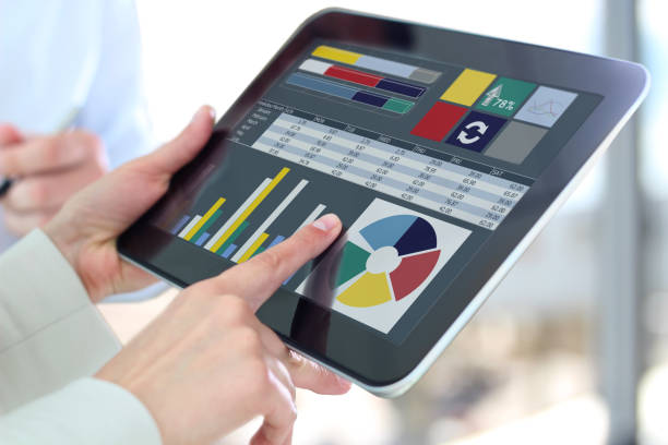 istock Business woman working and analyzing financial figures on a graphs on a tablet 1540478563