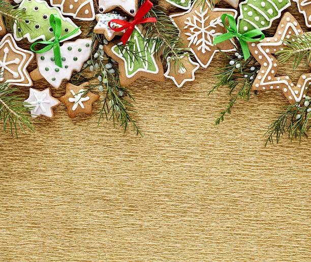Christmas Ginger cookies on gold background.