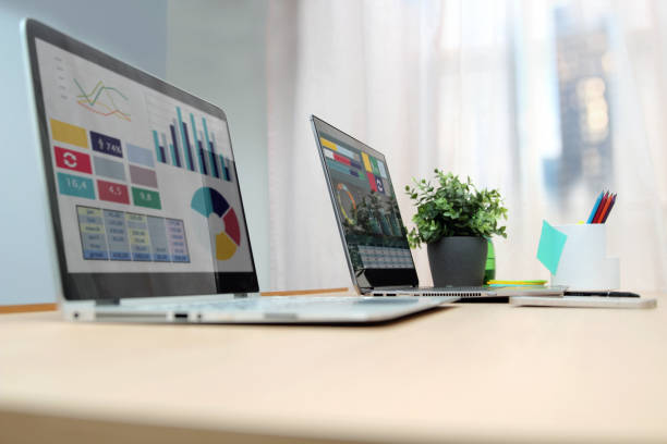 istock Working place with laptop, digital tablet; graphs at the office 1540481229