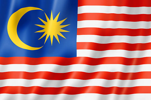 A rippled blue, yellow, red, and white Malaysian flag