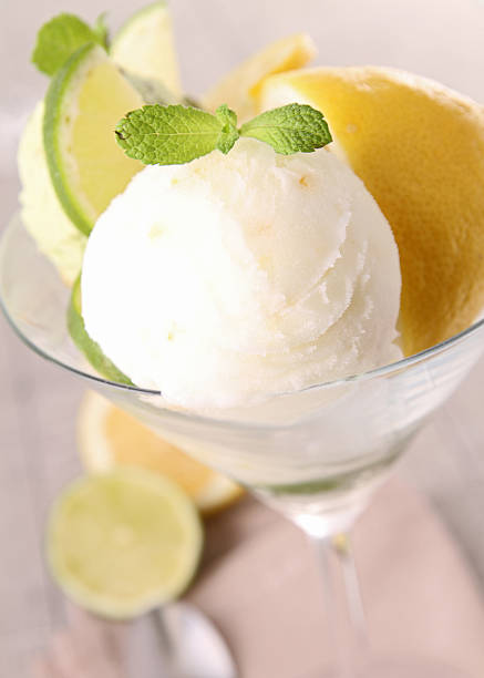 istock Ice cream with lemon in martini glass with lemons below 154050479