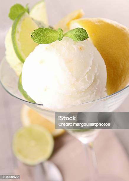 Ice Cream With Lemon In Martini Glass With Lemons Below Stock Photo - Download Image Now