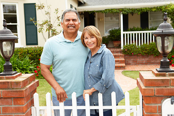 istock Senior Hispanic couple outside home 154050491