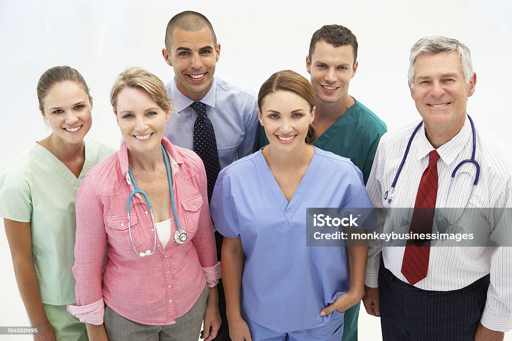 Professional medical staff of men and women Mixed group of medical professionals smiling at camera General Practitioner Stock Photo