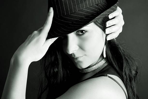 istock Young beautiful woman holding her hat 154050540