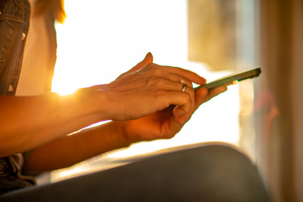 istock A woman sitting at her room window on at sunset 1540557748