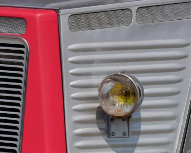A closeup of a vibrant red Citroen H Van