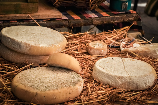 Traditional homemade cheese in farmer's market, Italy