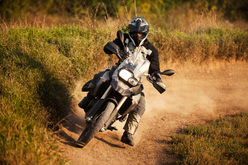 Enduro rider on track, strong grain added to create atmosphere.
