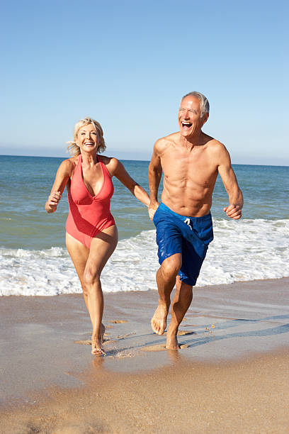 istock Senior Couple Enjoying Beach Holiday 154059044