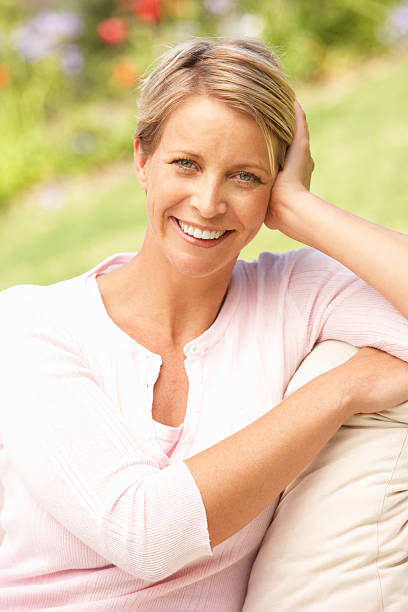 istock Young Woman Relaxing In Garden 154059056