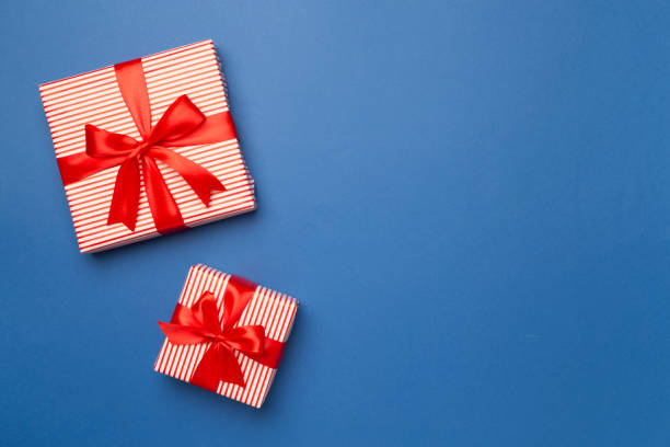 istock Gift boxes on color background, top view 1540597278