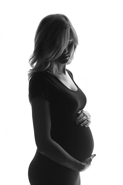 istock Young pregnant mother on white 154060361
