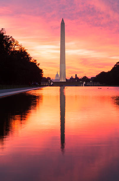 istock Brilliant sunrise over reflecting pool DC 154060656