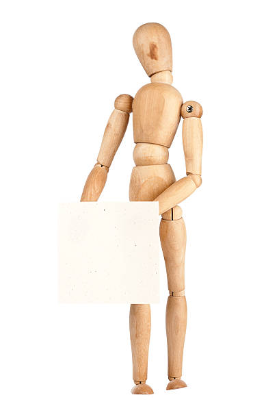 istock Wooden dummy holding paper 154060960