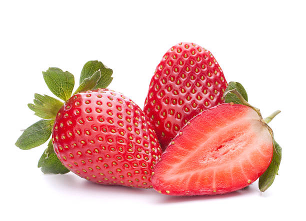 istock Three juicy strawberries, one halved on a white background 154061293