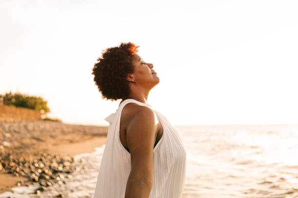 istock Young black woman breathing deep fresh air outdoor. 1540638310