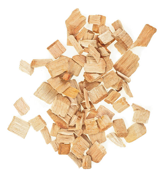 istock Group of wood chips isolated on a white background, top view. Wooden smoking chips. 1540645007