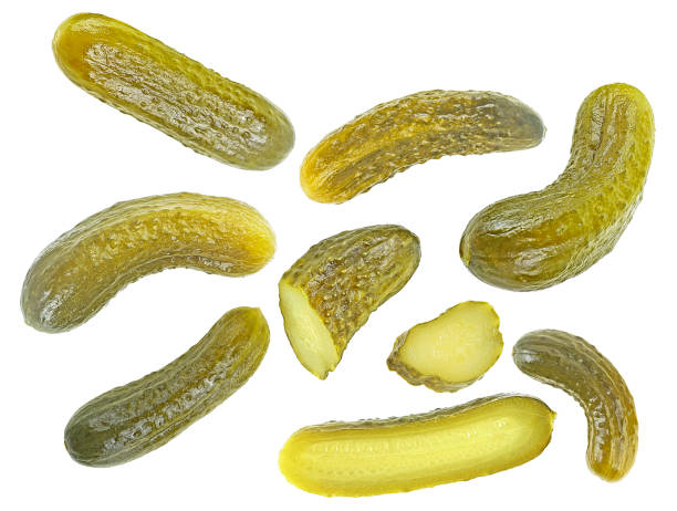 istock Delicious marinated pickled cucumbers isolated on a white background, top view. Pickled cucumbers collection. 1540645014