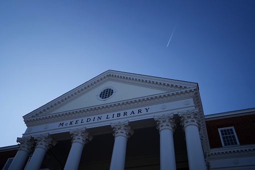 McKeldin Library of University of Maryland, close up, plane passing the clear sky