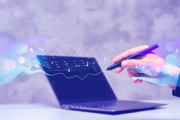 istock Businessman with laptop analyzes financial market data. Futuristic technology solution for business development. Abstract technological background in vibrant colors with blur. 1540649277